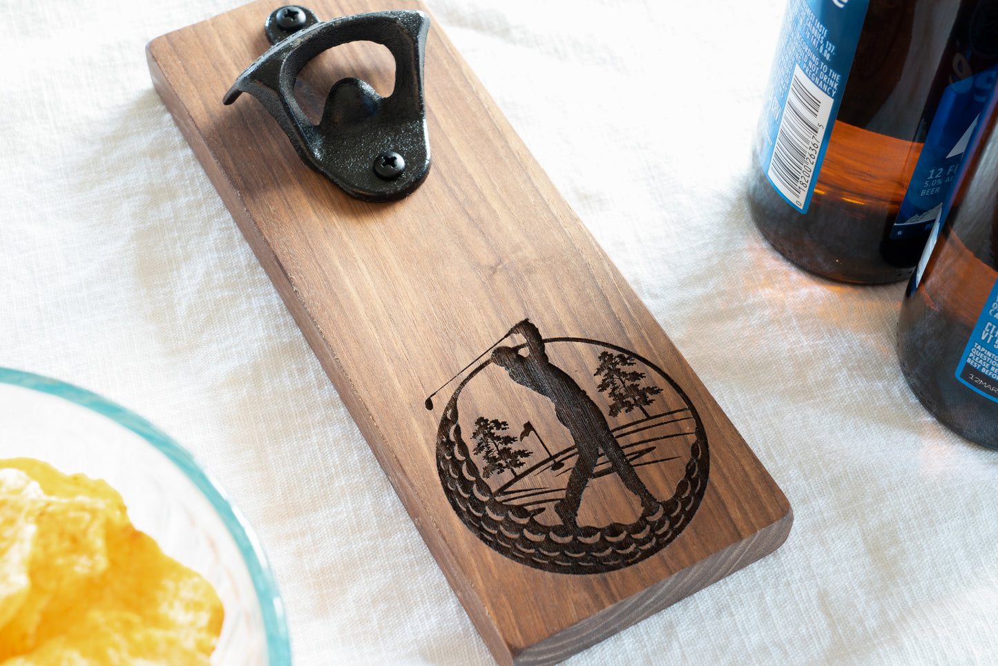 Golfer Bottle Opener on Walnut. Engraved golf ball design on magnetic bottle opener.