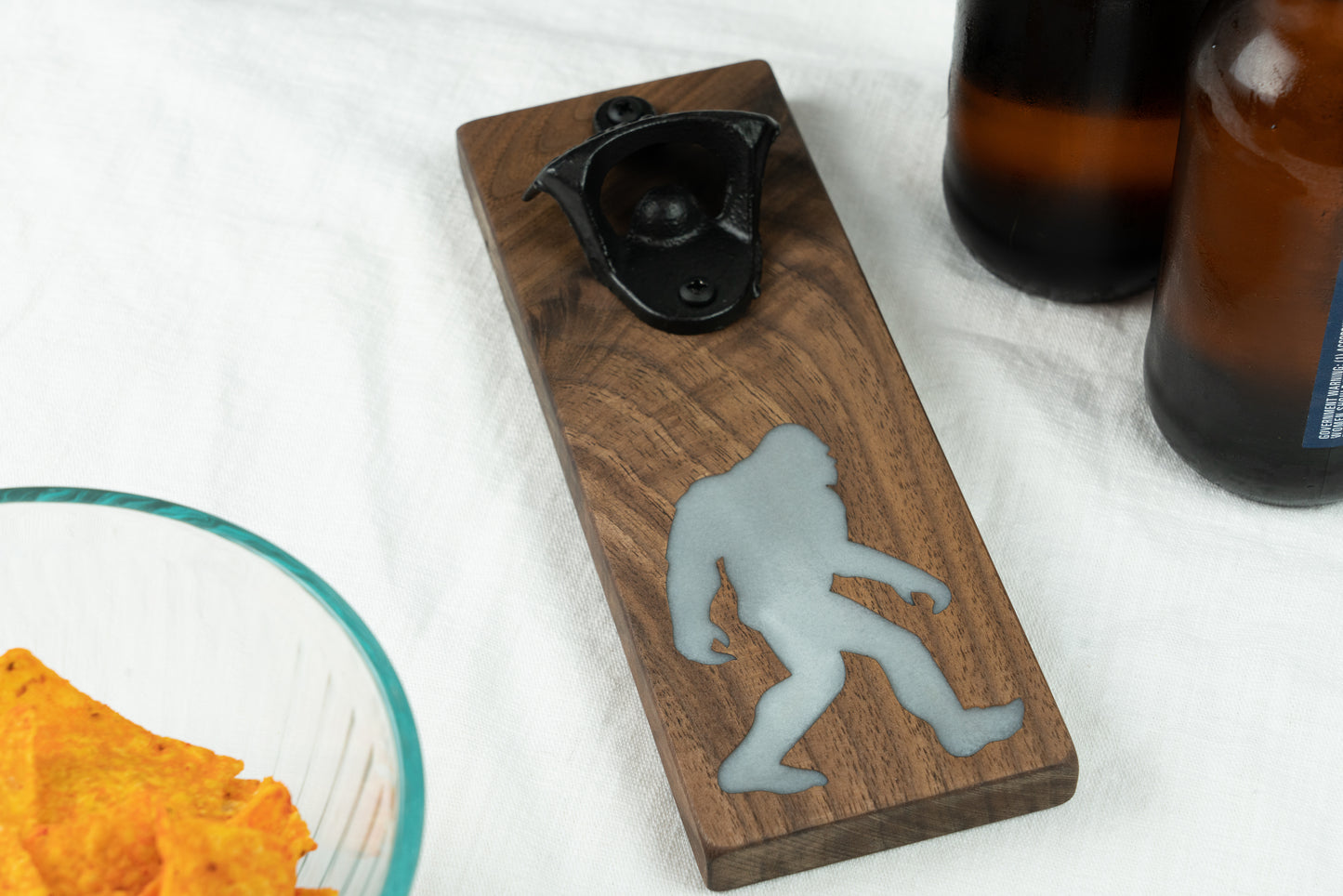 Glow in the Dark Sasquatch Bottle Opener on Walnut